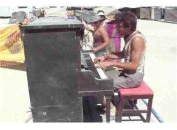 Fastest Rendition Of \'Hello Dolly\' On A Moving Piano