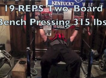 Most Two-Board Bench Presses Of A 315-Pound Barbell