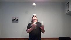 Most Catches Juggling Three Softballs In A Shower Pattern While Balancing A Softball On Forehead