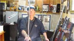Longest Time To Balance Two Bowie Knives On Top Of A Pole On Back Of Hand