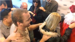 Most People Dancing In A Conga Line Led By Santa Claus