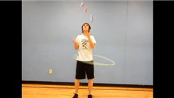 Most Balls Juggled While Hula Hooping