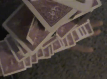 Most Cards Stacked Off Of A Ribbon Spread Balanced On One Arm