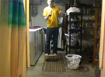 Most Consecutive Bounces Of A Ping Pong Ball Off A Nintendo DS Lite Cartridge While Balancing On A Rola Bola