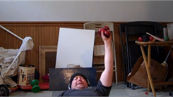 Most Balls Juggled In One Hand While Lying Down