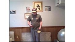 Most Flips Of A Waffle In A Seven Inch Diameter Skillet While Bouncing A Table Tennis Ball On A Paddle In The Other Hand In 30 Seconds
