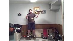 Most Thumb-Arounds With A Drum Stick While Spinning A Pillow In The Other Hand And Balancing On A Rola Bola In 30 Seconds