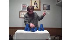 Most Sets Of One-Handed 3-3-3 Speed Stacking While Spinning A Toothbrush In The Other Hand In One Minute