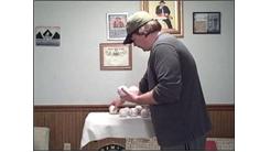 Most Baseballs Held In One Hand At Once
