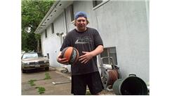 Most Consecutive Behind-The-Back Bounces Of A Basketball Off Of The Side Of A Building From Three Feet Away  While On A Rola Bola