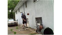 Most Consecutive Behind-The-Back Bounces Of A Basketball Off Of The Side Of A Building From Three Feet  Away While On A Rola Bola In 30 Seconds