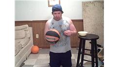Tallest Penny Tower Stacked On A Basketball Held In Hand