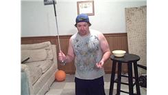 Tallest Penny Tower Stacked On The Head Of A Golf Club Held In Hand