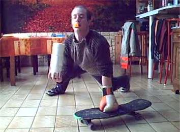 Most One-Armed Push-Ups On A Skateboard While Wearing A Glove, Balancing Three Toilet Paper Rolls And Balancing A Table Tennis Ball On A Spoon Held By Mouth