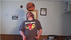Most Catches Juggling Four Balls While Spinning A Basketball On The Tip Of A Pen Held In Mouth