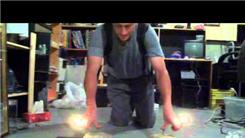 Longest Two-Thumb Plank On Two Nails While Holding Two Burning Candles In Each Hand
