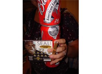 Most 24-Ounce Cans Of Budweiser Held In One Hand With An Optimo Cigar And Lottery Ticket