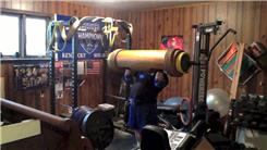Most Overhead Presses Using A 205-Pound Wooden Log
