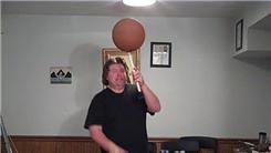 Most Consecutive Catches Juggling Three Balls Over The Head While Spinning A Basketball On A Mouthstick