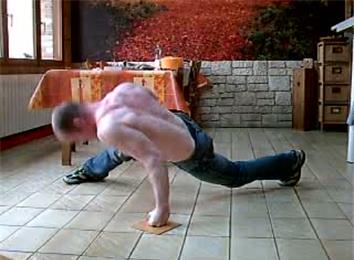 Most Consecutive One-Armed Push-Ups On Knuckles On Wooden Floor