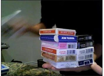 Most Decks Of Cards Held In Hand At Once