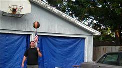 Longest Time To Spin A Basketball On Top Of An American Stick Flag Held In Hand