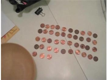 Most American Pennies Balanced On Elbow And Caught