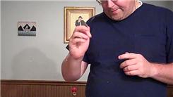 Most One-Handed Coin Rolls Using Two Eisenhower Silver Dollars In 30 Seconds