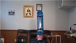 Longest Time Balancing Skateboard On Chin While Seated