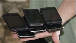 Most iPhones Held In Hand At Once 