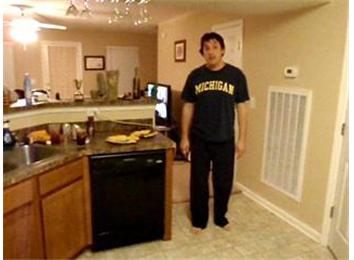 Most Slices Of Cheese Placed On Face While Standing On One Leg And Wearing A Michigan T-Shirt