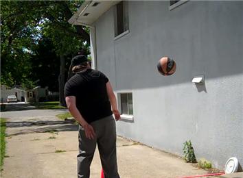 Most Behind-The-Back Bounces Of A Basketball Off The Side Of A Building From Six Feet Away In One Minute