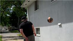 Most Behind-The-Back Bounces Of A Basketball Off The Side Of A Building From Six Feet Away In One Minute