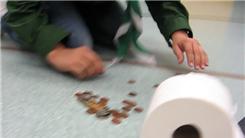 Tallest Coin Tower Balanced On A Roll Of Toilet Paper