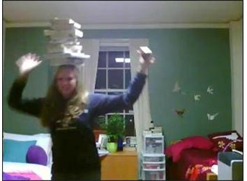 Fastest Time To Say First 100 Digits Of Pi While Twisting A Rubik\'s Cube And Balancing 15 Books On Head