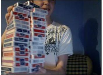 Most Decks Of Cards Held In Hand At Once