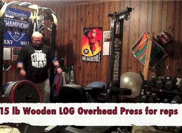 Most Overhead Presses Using A 215-Pound Wooden Log