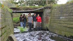 Most People Drinking Beer While Standing In A River