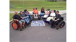 Largest Group Of People In Wheelchairs In A Disabled Parking Space At Once