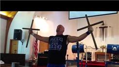Longest Time To Hold Two 27-Pound Steel Crosses With Extended Arms