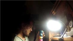 Tallest Juggling Ball Tower Stacked On A Light Bulb Held In Hand