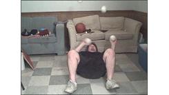 Most Consecutive Catches Juggling Four Softballs While Lying On Back