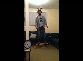 Longest Time To Balance An Upside-Down Shoe On Top Of Head While Balancing On A Rola Bola