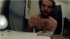 Tallest Penny Tower Stacked On A Deck Of Playing Cards While Dealing The Top Card Out