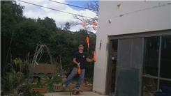 Most Consecutive Catches Juggling Five Clubs While Balancing On A Rola Bola