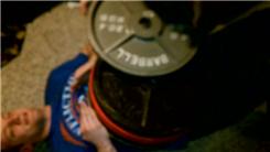 Most Weight In Olympic Plates Stacked On Top Of Someone
