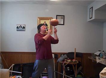 Most Playing Cards Dealt Individually With One Hand While Spinning An American Football On One Finger