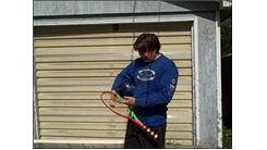 Longest Time To Balance Bowling Ball On A Tennis Racket With One Hand