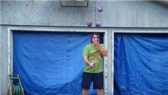 Most Catches Juggling Five Two-Pound Balls While Balancing A Rola Bola