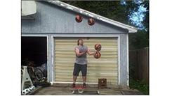Most Catches While Juggling Four Basketballs While Balancing On A Rola Bola